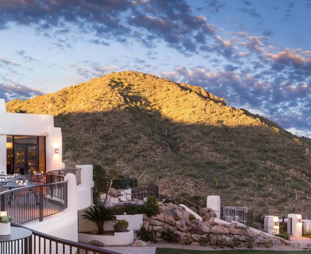 The CIELO terrace at Adero at golden hour, below the mountain